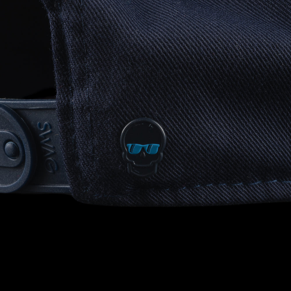 Navy blue cap with a colorful 'SWAG' patch featuring a cartoon character on a black background