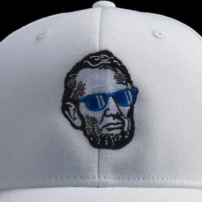 White SWAG Golf cap with a graphic of a Abe Lincoln wearing sunglasses on a black background