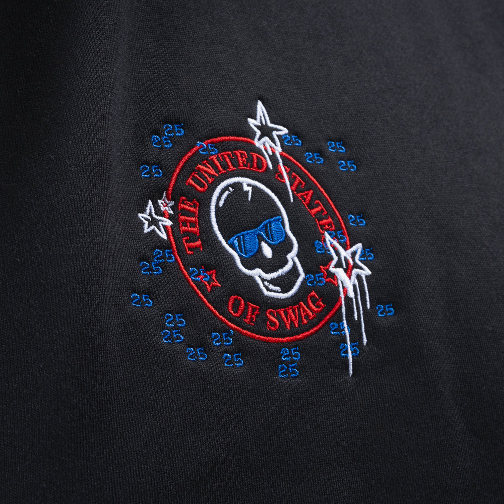 Person wearing a black hoodie with a colorful United States of SWAG graphic design.