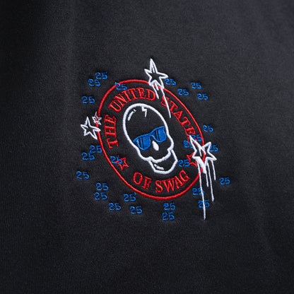 Person wearing a black hoodie with a colorful United States of SWAG graphic design.