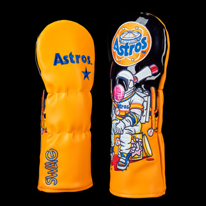 SWAG Golf Houston Astros fairway cover shown front and back with a retro Astros logo on the back and an astronaut sitting on a cooler surrounded by baseball gear, bats, and space-inspired artwork in vintage Astros colors.