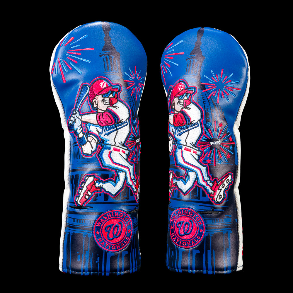 SWAG Golf Washington Nationals fairway cover featuring a comic-style Nationals batter wearing mirrored sunglasses with the U.S. Capitol, red and blue fireworks, a "POP!" burst, and the Washington Nationals circular logo.