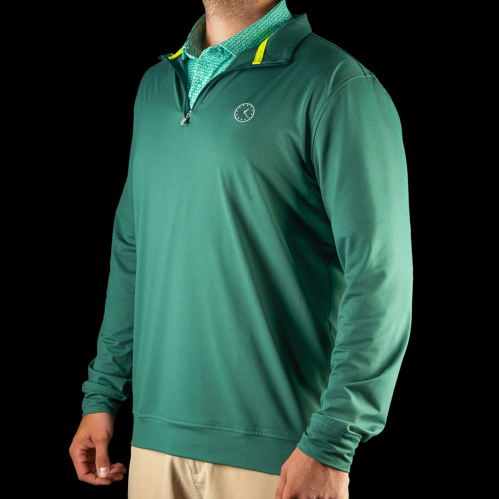 Side view of the Chicago Cubs 1:20 Clock Club Quarter-Zip featuring green fabric and contrast collar accents.