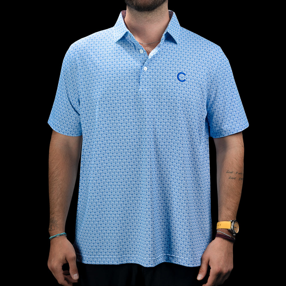 SWAG Golf Chicago Cubs Geometric Logo Classic Polo Shirt in light blue with an all-over geometric pattern and embroidered Cubs C chest logo.