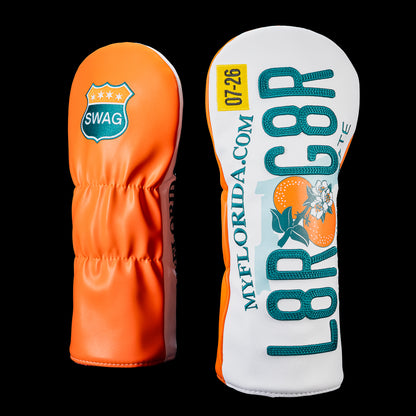 Florida driver headcover featuring a white Florida license plate inspired design with oversized "L8R G8R" lettering, oranges, "MyFlorida.com" text, a July 26 registration sticker, and bright orange side panels. Back features an orange panel with the SWAG shield logo.