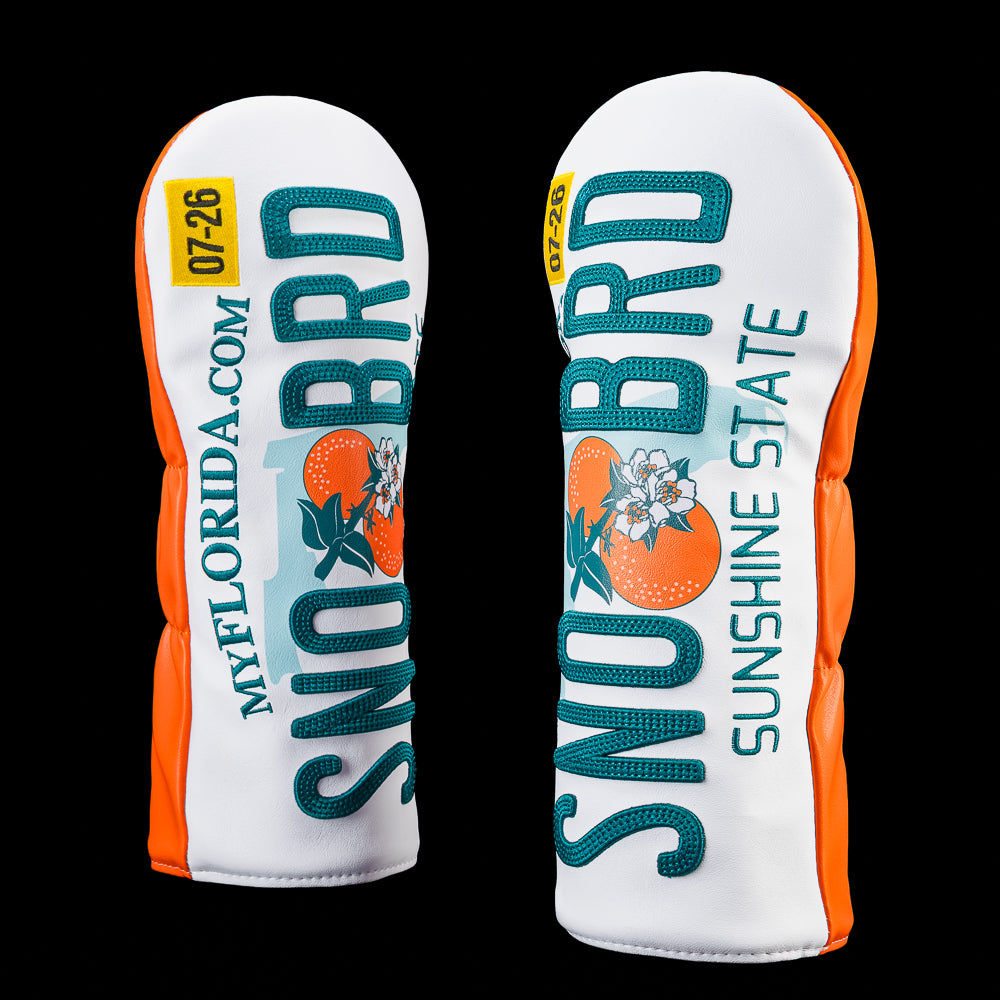 Side view of the Florida Snow Bird driver headcover featuring a Florida license plate inspired design with vertical "SNO BRD" lettering, oranges, "Sunshine State" text, and orange side panels.