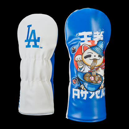Los Angeles Dodgers driver cover featuring a white back embroidered with the classic LA logo and a blue front with an embroidered lucky cat wearing a Dodgers cap, eating ramen from a bowl filled with baseballs, surrounded by Japanese-inspired artwork and bold white lettering.