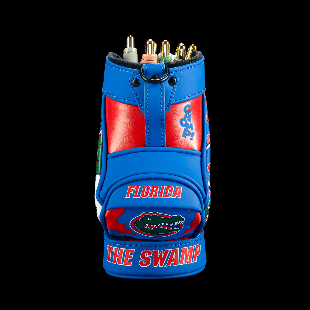 Front view of the Florida Gators Desk Caddy with blue outer panels, red center sections, Florida lettering, small alligator graphics, and “The Swamp” text along the base.