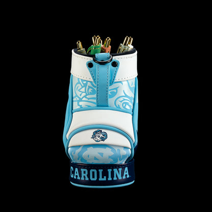 Front view of the North Carolina Tar Heels Desk Caddy with Carolina blue and white panels, pale blue line illustrations, a white center section, and “Carolina” lettering along the base.