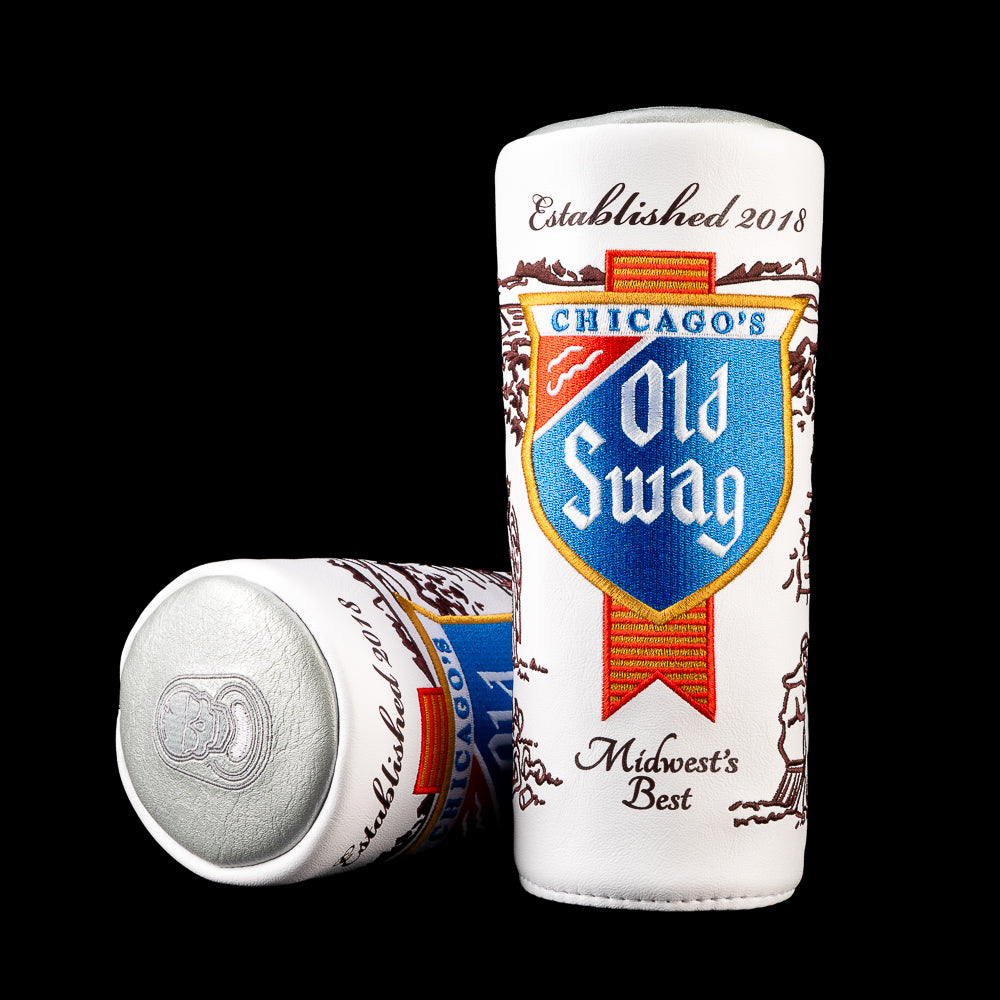 White Old Swag Barrel fairway wood cover with a blue and red shield logo, brown illustrated scenes, and vintage-inspired embroidered lettering.