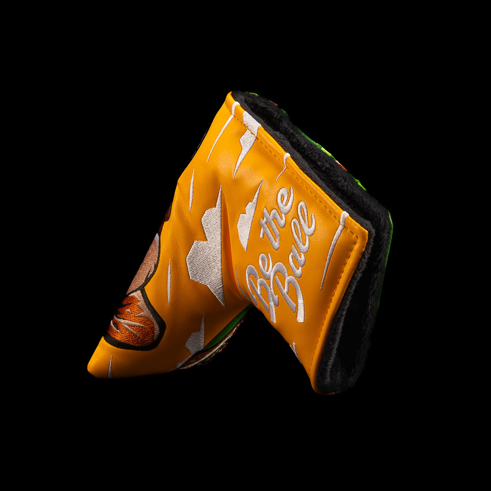 Orange side of Rewind Golf Caddyshack Be the Ball blade headcover with white Be the Ball embroidery.