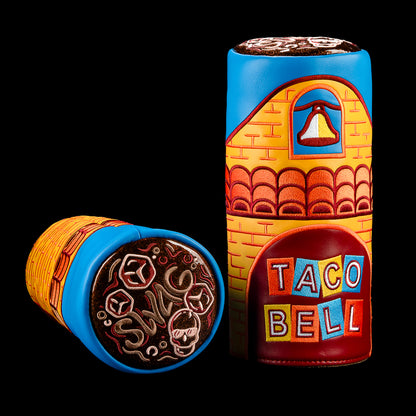 Taco Bell x SWAG Golf Retro Cup Barrel Driver Cover with a blue top, orange brick pattern and vintage Taco Bell logo, shown upright and on its side.
