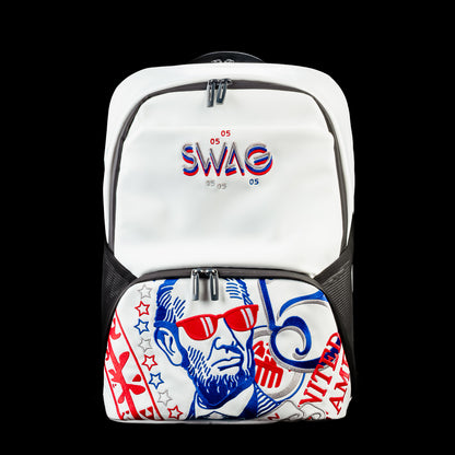 Front view of the RWB Gigantic Lincoln Backpack featuring patriotic red, white, and blue Abraham Lincoln artwork, a large front zip pocket, and embroidered SWAG logo.