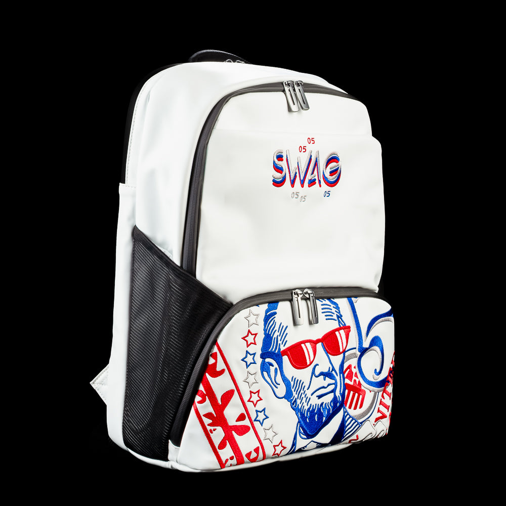 Angled side view of the RWB Gigantic Lincoln Backpack showing patriotic Lincoln graphics, black side panel, adjustable shoulder straps, and front storage pocket.
