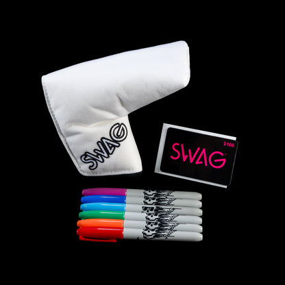 White golf club head cover with 'SWAG' branding, colorful markers, and a small card with 'SWAG' on a black background.