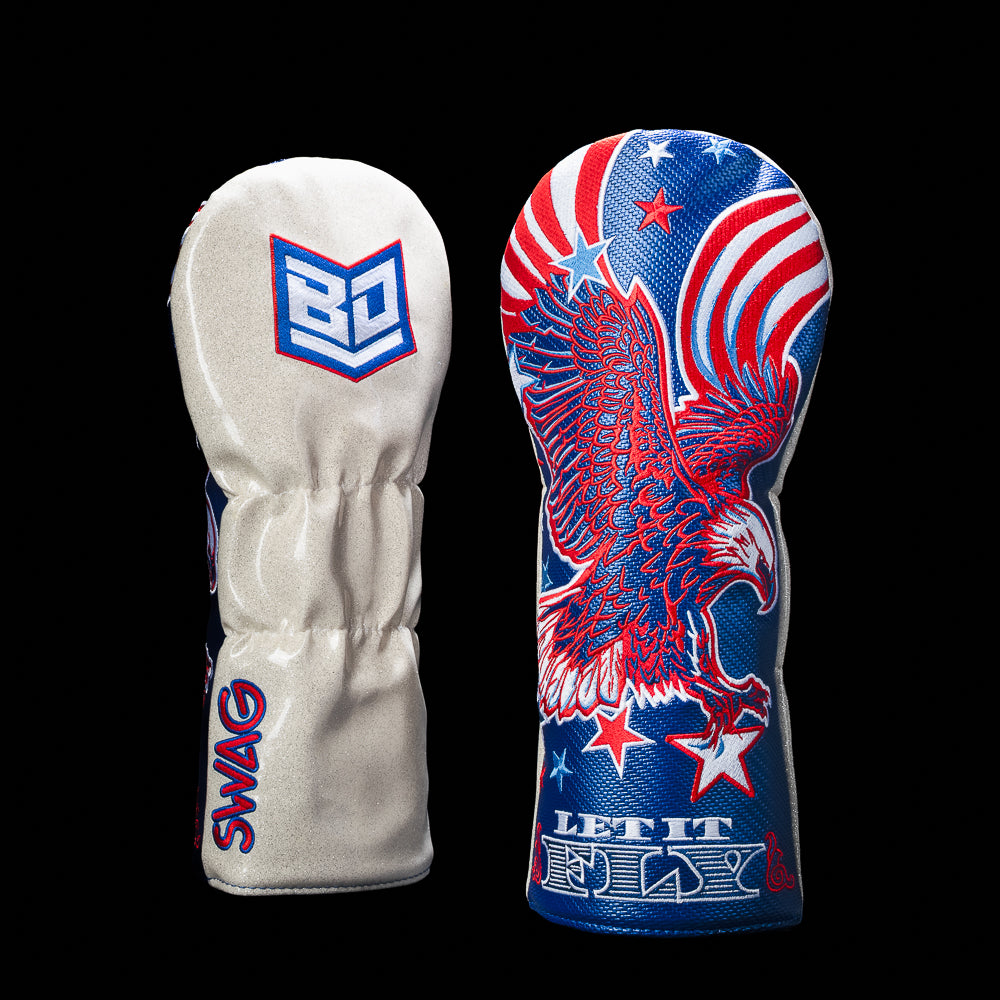 BD x SWAG Golf Let It Fly red, white, and blue driver golf headcover with flying eagle on the front and BD shield logo on the back.