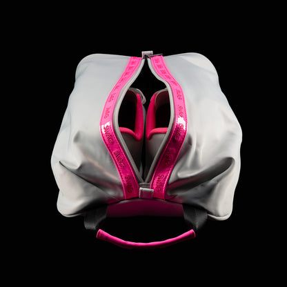 Top-down view of open SWAG Golf shoe bag showing dual shoe compartments with black interior lining and zipper accents.