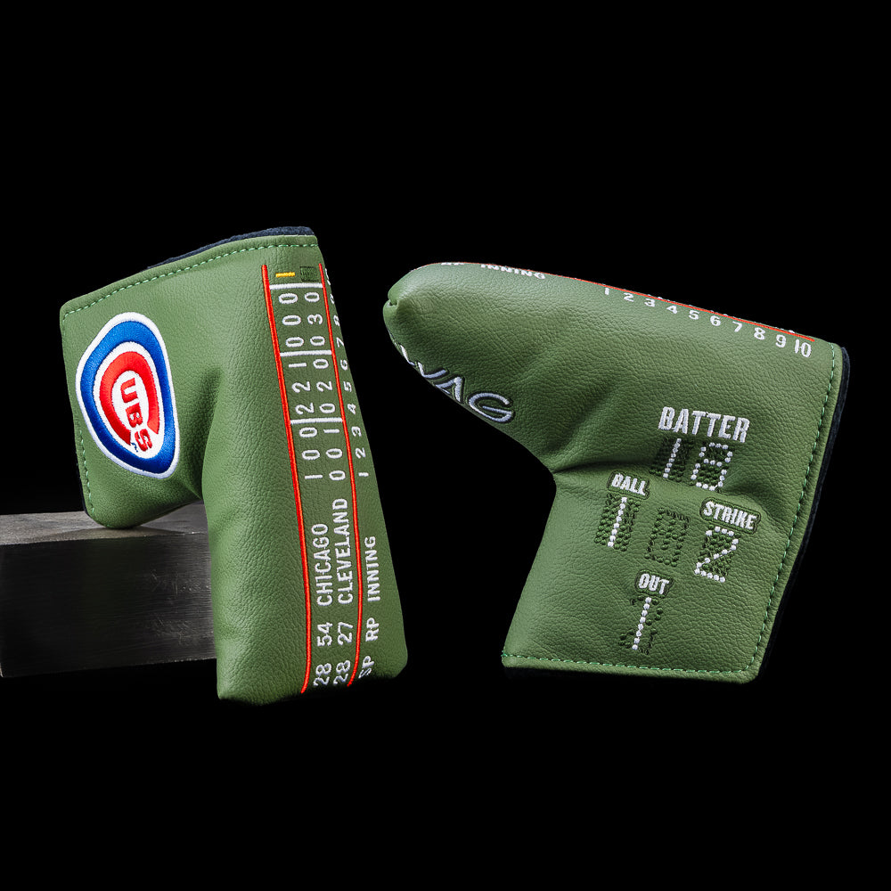 Chicago Cubs blade putter headcover inspired by the iconic Wrigley Field hand-operated scoreboard featuring inning-by-inning scoring, batter number, ball, strike and out indicators, Cubs logo, and dark ivy green design.