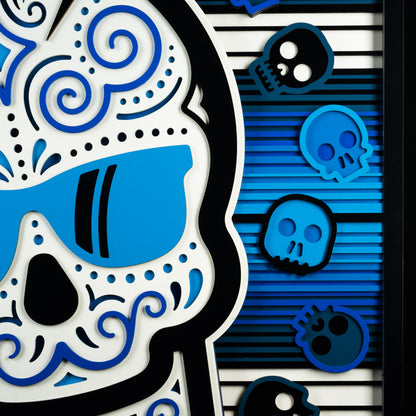 Swag x Andre Kaut wood art panel serape sugar skull themed in blue, white and black.