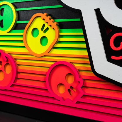 Swag x Andre Kaut wood panel artwork serape sugar skull themed in neon green, pink, orange, yellow and black.