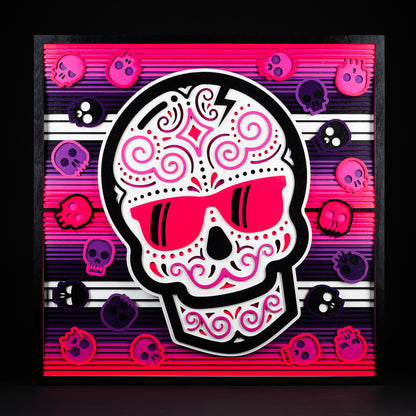 Swag x Andre Kaut wood panel artwork serape sugar skull themed in pink, black, white and purple.