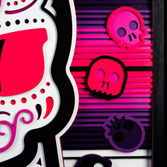 Swag x Andre Kaut wood panel artwork serape sugar skull themed in pink, black, white and purple.