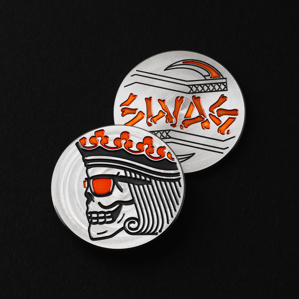 Skeleton King of Swag orange and black stainless steel round golf ball marker accessory.