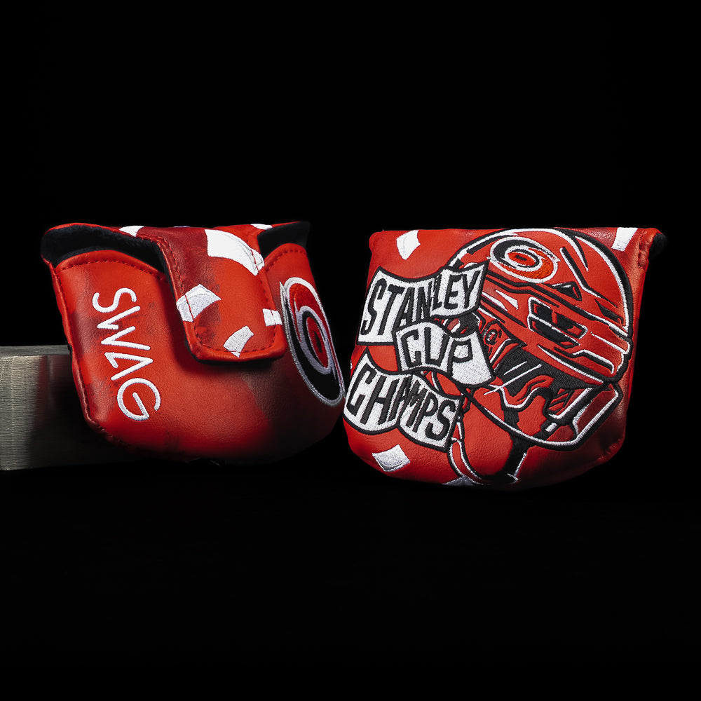 Red Carolina Hurricanes golf mallet headcover with 'Stanley Cup Champs' and 'Swag' text on a black background