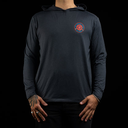 Person wearing a navy long-sleeve hoodie with a United States of SWAG logo on the chest against a black background