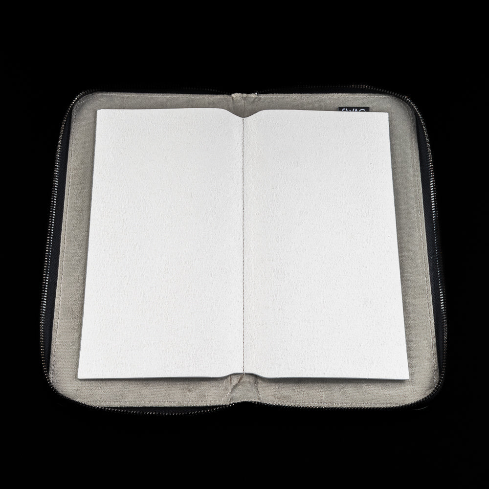 Open white SWAG Golf glove folio with soft interior lining designed to keep golf gloves flat and protected.
