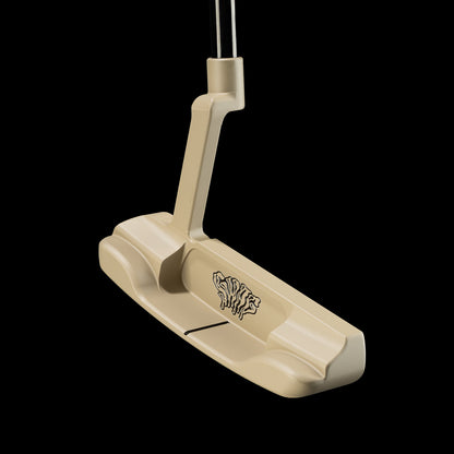 A beige golf putter with a black dripping SWAG logo on the cavity, shown against a solid black background.