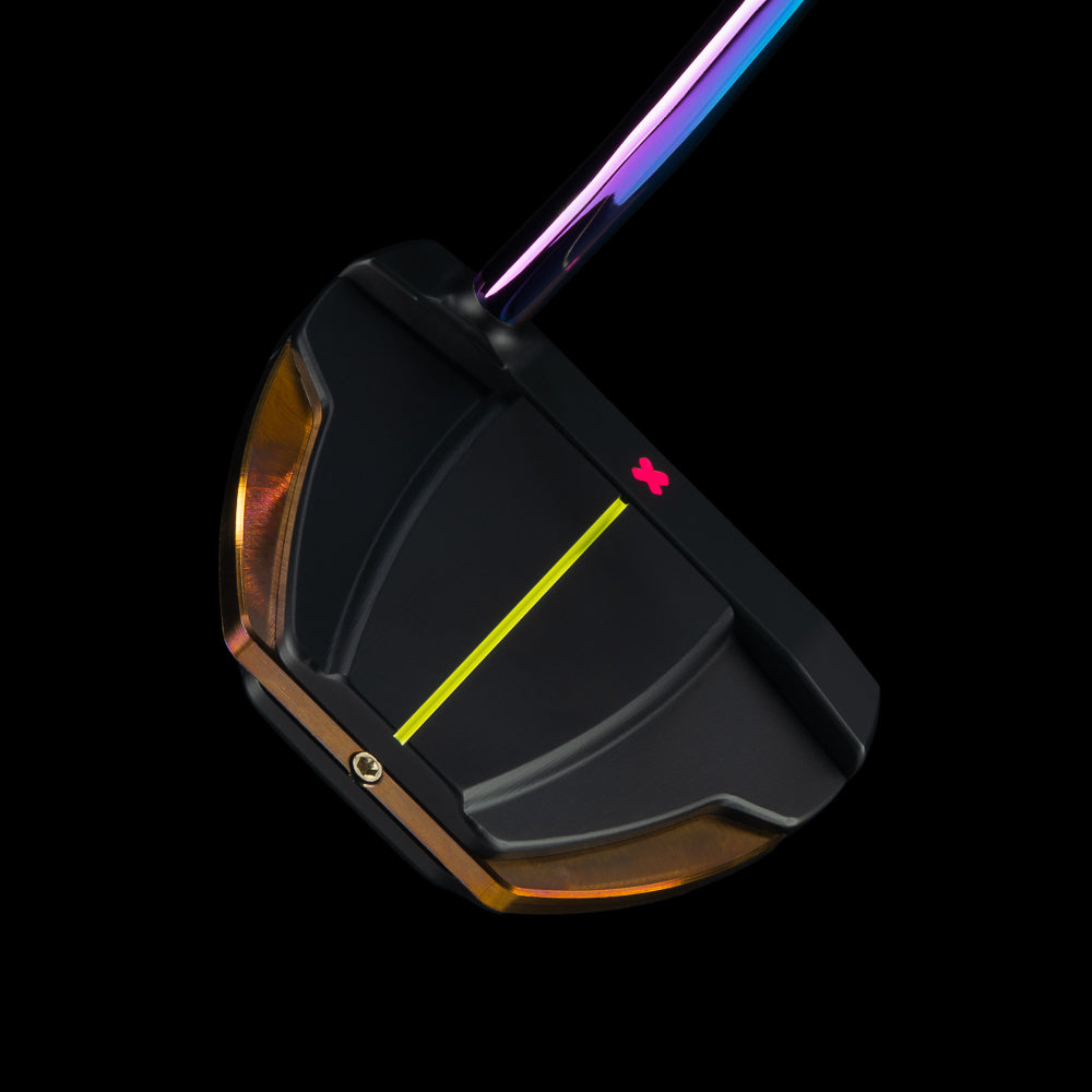 A close-up studio shot of a black golf putter head with a bright yellow center line, a small red logo, and a metallic iridescent shaft against a solid black background.
