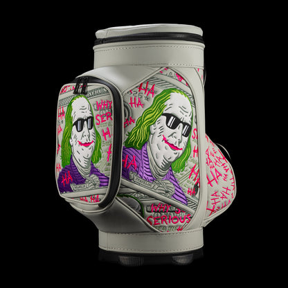 Angled view of SWAG Golf Defaced Franklin Den Caddy Cooler showing illustrated pockets and hot-pink graffiti.