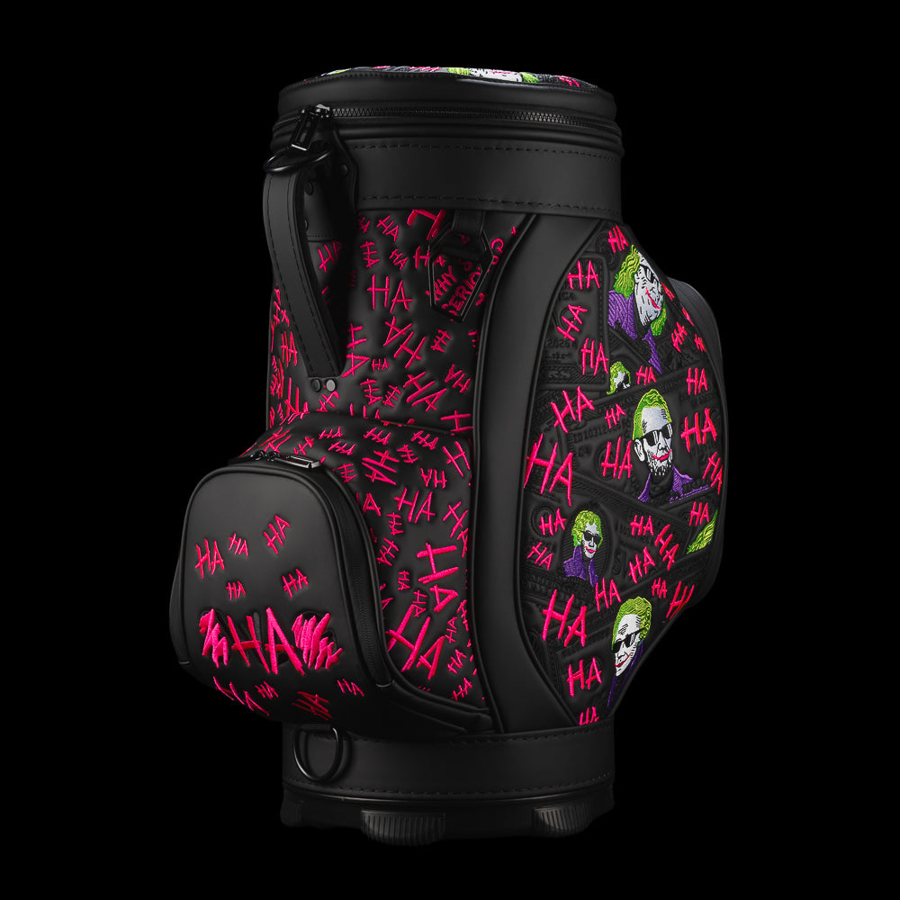 Angled view of Defaced Dollar Bills Den Caddy Cooler showing pink graffiti, colorful portraits, and SWAG logo pocket.