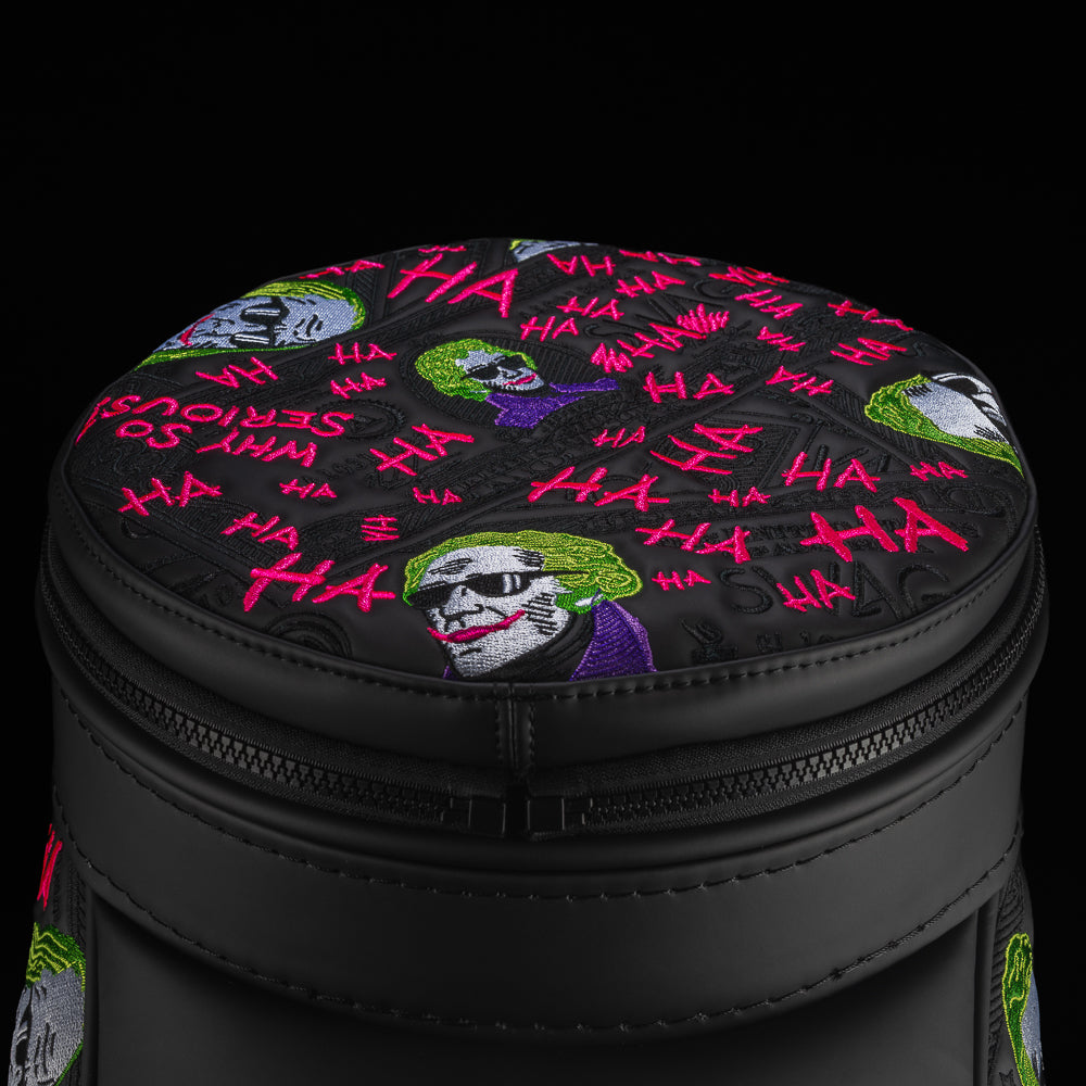Close-up of Defaced Dollar Bills Den Caddy Cooler lid with colorful currency portraits and hot-pink graffiti on black.
