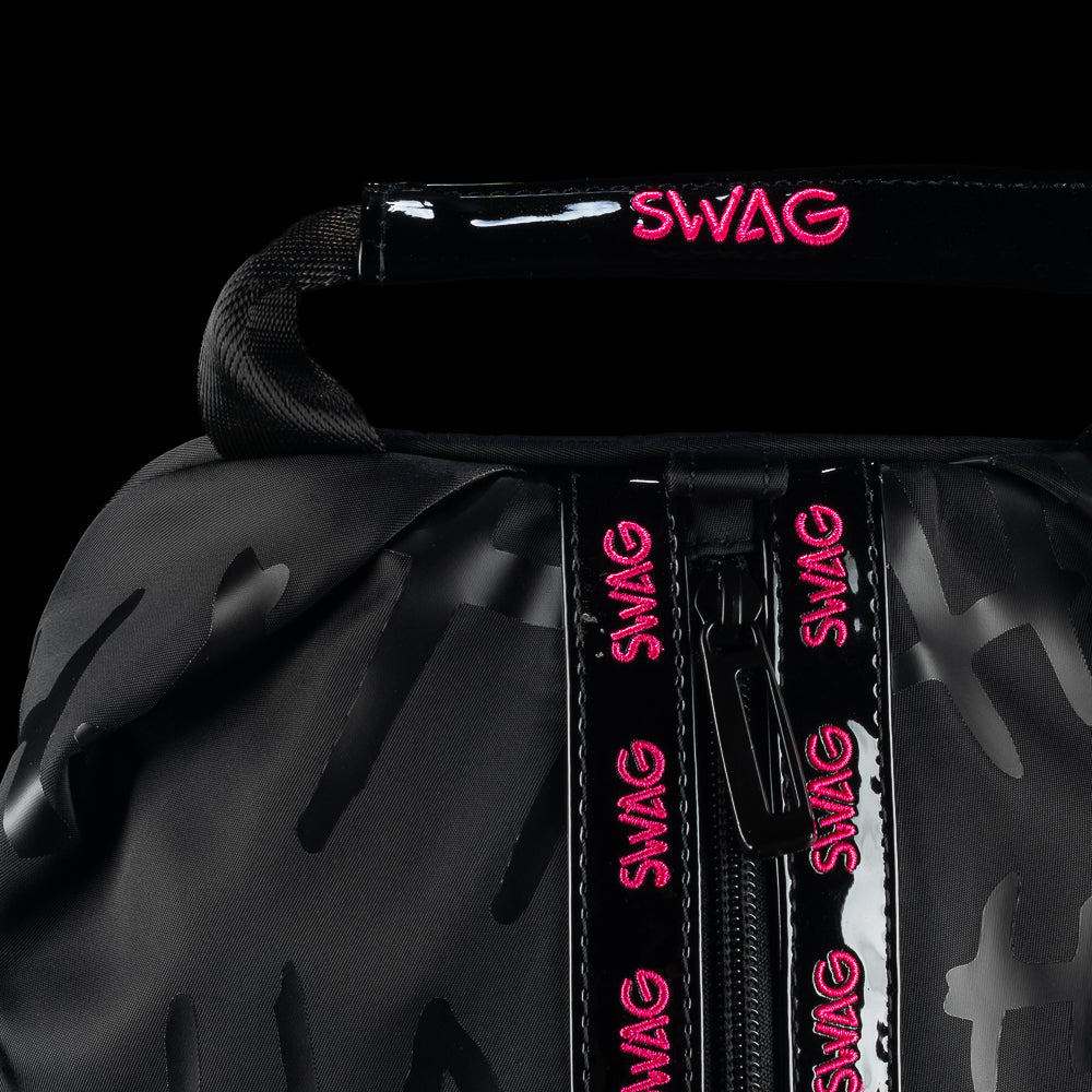 Close-up of SWAG Golf Defaced shoe bag handle and front zipper with pink SWAG lettering.