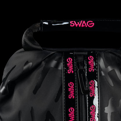 Close-up of SWAG Golf Defaced shoe bag handle and front zipper with pink SWAG lettering.