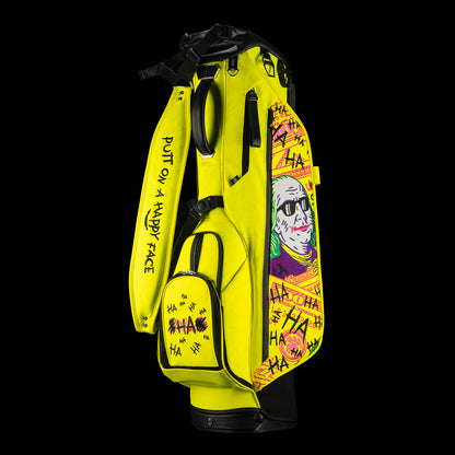 SWAG Golf x Vessel VLS Lux golf stand bag with neon yellow material and embroidered Defaced Franklin design on pink dollar bill themed panels. 