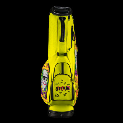 SWAG Golf x Vessel VLS Lux golf stand bag with neon yellow material and embroidered Defaced Franklin design on pink dollar bill themed panels. 