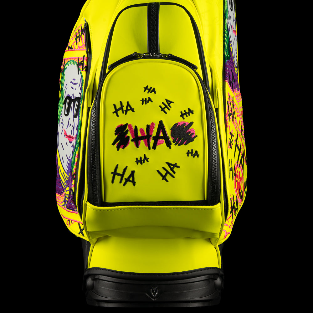 SWAG Golf x Vessel VLS Lux golf stand bag with neon yellow material and embroidered Defaced Franklin design on pink dollar bill themed panels. 