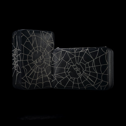 Black SWAG Golf Spider Web cigar humidor travel case shown from two exterior angles with gray web artwork and a central skull emblem.