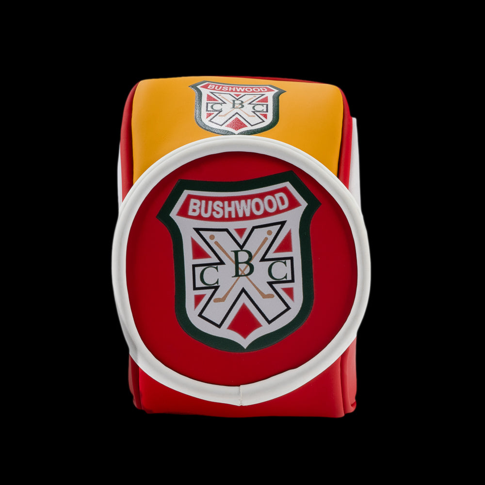 Bottom view of the Rewind Golf Caddyshack Czervik Desk Caddy featuring a large Bushwood crest on a red background with white trim.