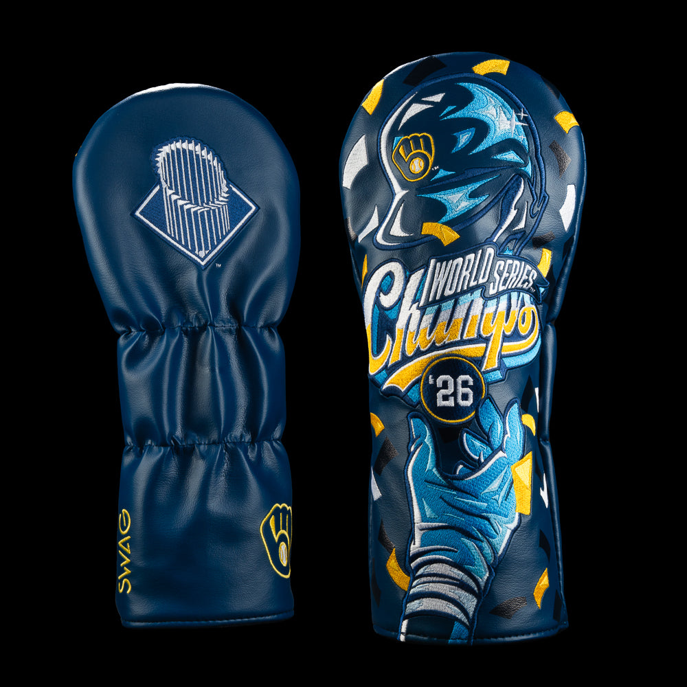 Front and back views of a navy blue golf club headcovers displayed side by side against a black background. The back features a white World Series trophy logo, and the right cover features a blue and yellow Milwaukee Brewers World Series Champs graphic.