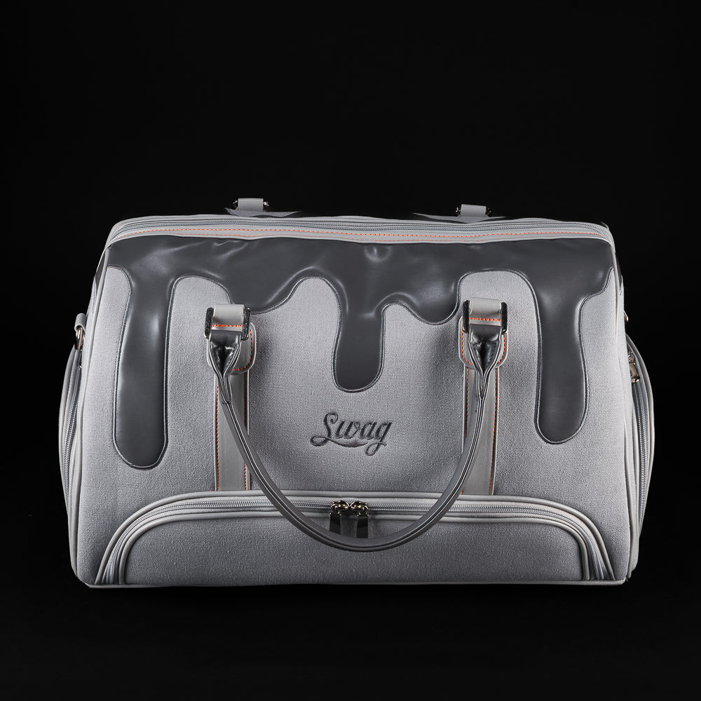 Front view of SWAG Golf Dripping Duffle Bag featuring grey body, black drip accents, embroidered SWAG logo, and zipper pocket.