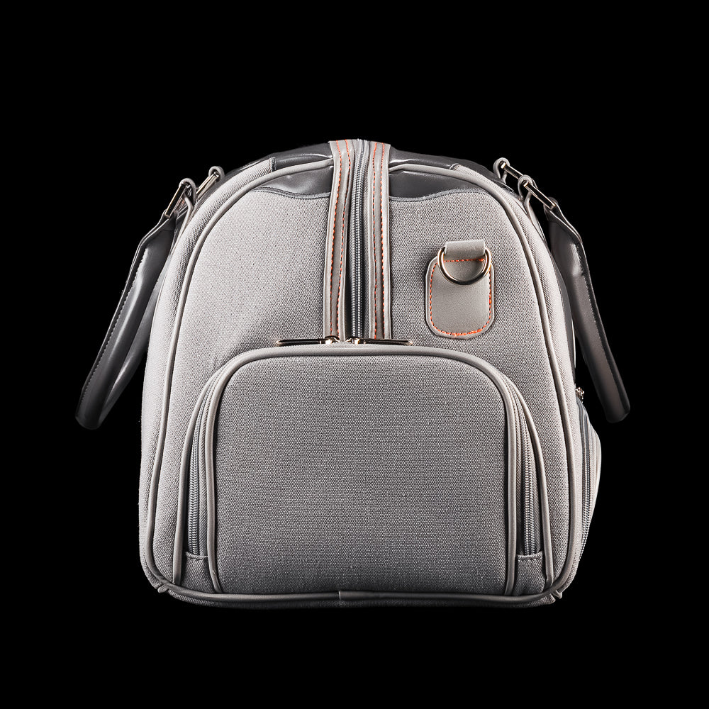 Side profile of SWAG Golf Dripping Duffle Bag showing structured end pocket, durable body, and black drip overlay design.