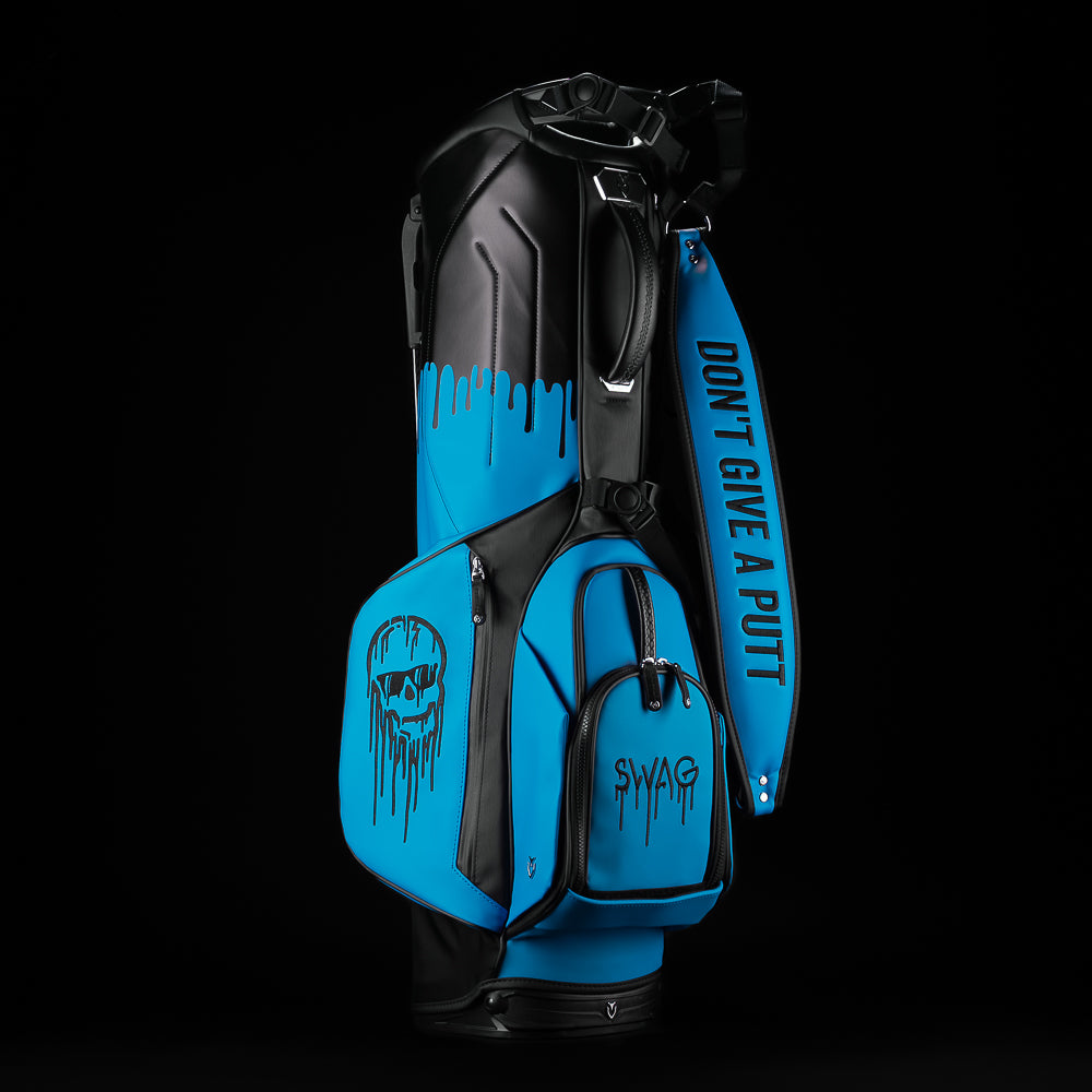 Blue and black SWAg Golf x Vessel golf stand bag with 'Don't Give a Putt' and 'Swag' text on a black background