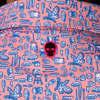 SWAG Golf Backyard BBQ Classic Polo back collar detail featuring signature pink skull logo surrounded by burgers, hot dogs, grills, and backyard feast graphics