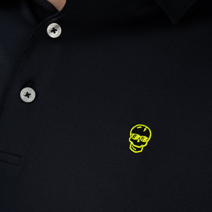 Close-up of embroidered neon skull logo on SWAG Golf Black Skull Classic Polo performance golf shirt featuring signature SWAG skull graphic
