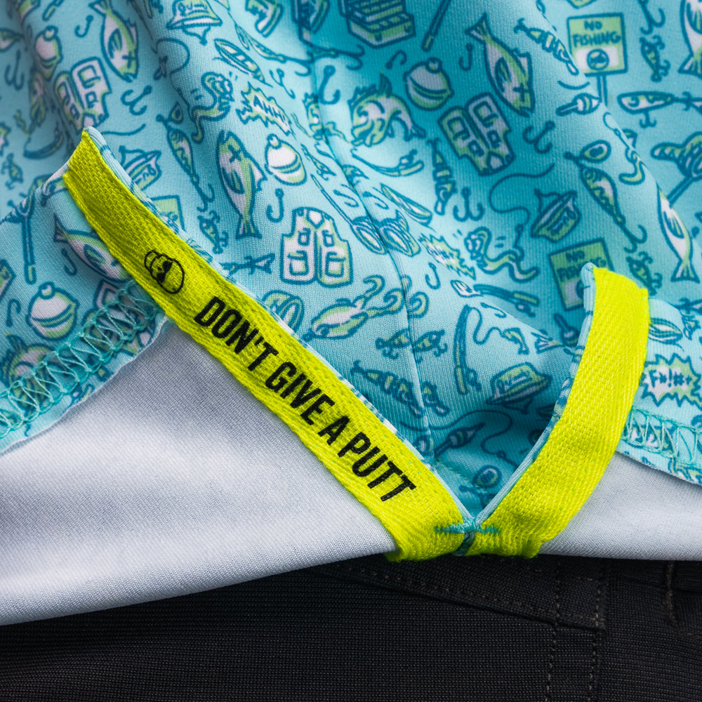 Interior detail of SWAG Golf Gone Fishing Classic Polo featuring signature Don't Give A Putt embroidery tape in high-visibility neon accent color