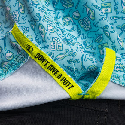 Interior detail of SWAG Golf Gone Fishing Classic Polo featuring signature Don't Give A Putt embroidery tape in high-visibility neon accent color